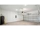 Attached garage for two cars with garage door opener and visible water heater at 2354 Broadbrook Dr, St Cloud, FL 34771