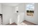 Well-lit hallway with neutral carpet, staircase and large windows that provide natural light and scenic views at 2354 Broadbrook Dr, St Cloud, FL 34771