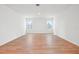 Spacious living room with hardwood floors, neutral walls, and natural light at 2354 Broadbrook Dr, St Cloud, FL 34771