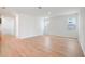 Bright living room featuring hardwood floors, two windows, and white trim at 2354 Broadbrook Dr, St Cloud, FL 34771