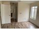 Bedroom with laminate flooring and access to the bathroom at 236 Bay Head Dr, Kissimmee, FL 34743