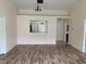 Living room with laminate wood flooring and views through to other rooms in the house at 236 Bay Head Dr, Kissimmee, FL 34743