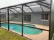 Enjoy swimming year-round in this screened-in pool, which features multiple access points for convenience and enjoyment at 236 Bay Head Dr, Kissimmee, FL 34743