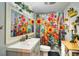 Bright bathroom featuring sunflower-themed decor, a vanity, and a shower with curtain at 2410 E Church St, Orlando, FL 32803