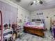 Whimsical bedroom with decorated walls, canopy bed and cute furniture at 2410 E Church St, Orlando, FL 32803