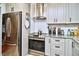 Modern kitchen with stainless steel appliances, granite counters, and ample cabinet space at 2410 E Church St, Orlando, FL 32803