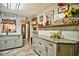 Stylish kitchen featuring granite counters, decorative shelves, and farmhouse-inspired decor at 2410 E Church St, Orlando, FL 32803