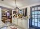 Functional kitchen with granite countertops, stylish rug, and an open view into the living room at 2410 E Church St, Orlando, FL 32803