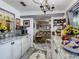 Galley kitchen featuring granite counters, wood style floor, and bright natural light at 2410 E Church St, Orlando, FL 32803