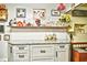 Bright kitchen featuring granite counters, decorative shelves, and vintage decor at 2410 E Church St, Orlando, FL 32803
