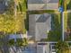 Aerial view showcases the roof, driveway, and surrounding neighborhood at 2418 Whitehall Cir, Winter Park, FL 32792