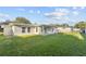A spacious backyard with a patio area, perfect for outdoor entertaining and relaxation at 2418 Whitehall Cir, Winter Park, FL 32792