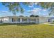 Charming home featuring manicured landscaping, a well-kept lawn, and a clean, bright exterior at 2418 Whitehall Cir, Winter Park, FL 32792