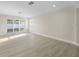 Bright living room with sliding glass doors that lead to the backyard at 2418 Whitehall Cir, Winter Park, FL 32792