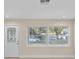 Bright living room with a new front door, fresh paint and modern, double-pane windows at 2418 Whitehall Cir, Winter Park, FL 32792