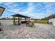 Large backyard featuring a pool, outdoor kitchen, and expansive patio space at 2424 Varenna Loop, Kissimmee, FL 34741