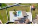Aerial view showcasing a pool, cabana and solar panels and well-manicured yard at 2424 Varenna Loop, Kissimmee, FL 34741