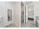 Bathroom hallway features a toilet and a doorway into a bedroom at 2424 Varenna Loop, Kissimmee, FL 34741