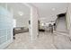 Bright foyer with staircase leading up and view into living and dining rooms at 2424 Varenna Loop, Kissimmee, FL 34741