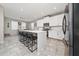 Open kitchen area with a large island and bar seating, perfect for entertaining guests at 2424 Varenna Loop, Kissimmee, FL 34741
