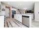 Stylish kitchen island with stainless steel appliances and sleek white cabinetry at 2424 Varenna Loop, Kissimmee, FL 34741