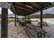 Outdoor kitchen with grill, bar seating, and picnic table at 2424 Varenna Loop, Kissimmee, FL 34741