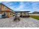 Extended patio with an outdoor kitchen and picnic table, ideal for outdoor living at 2424 Varenna Loop, Kissimmee, FL 34741