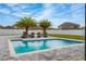 Backyard pool with chairs and trees at 2424 Varenna Loop, Kissimmee, FL 34741