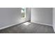 Cozy bedroom with natural light, neutral walls, carpet flooring and a closet at 30369 Apricot Ave, Eustis, FL 32736