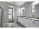 Elegant main bathroom with a double sink vanity and a glass-enclosed shower at 30369 Apricot Ave, Eustis, FL 32736