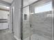 Modern bathroom with a glass-enclosed shower featuring tile accents and a built-in bench at 30369 Apricot Ave, Eustis, FL 32736