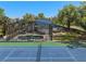 The backyard features a screened pool, spa, and tennis court at 3326 Butler Bay N Dr, Windermere, FL 34786