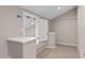 Basement area featuring built-in shelving and carpeted floors, perfect for a home office or storage at 3326 Butler Bay N Dr, Windermere, FL 34786