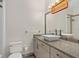 Bathroom featuring a vessel sink atop a speckled granite countertop and modern fixtures at 3326 Butler Bay N Dr, Windermere, FL 34786