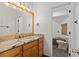 Bathroom boasts a vanity with a granite countertop, a sink, and a separate toilet room at 3326 Butler Bay N Dr, Windermere, FL 34786