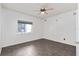 This bedroom features tile floors, ceiling fan and a large window at 3326 Butler Bay N Dr, Windermere, FL 34786
