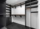 Walk-in closet features multiple shelves, rods and drawers for organized clothing storage at 3326 Butler Bay N Dr, Windermere, FL 34786