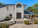 Elegant home entrance with a double door, water feature, and beautiful landscaping at 3326 Butler Bay N Dr, Windermere, FL 34786