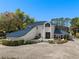 Stunning two-story home featuring a blue tile roof and lush landscaping at 3326 Butler Bay N Dr, Windermere, FL 34786