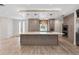 Kitchen with island, custom cabinetry, stainless appliances, and white countertops at 3326 Butler Bay N Dr, Windermere, FL 34786
