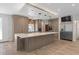 Kitchen with custom cabinets, stainless steel appliances, and large center island at 3326 Butler Bay N Dr, Windermere, FL 34786