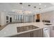 Open kitchen with modern countertops, island cooktop, and a view to the living area, perfect for entertaining at 3326 Butler Bay N Dr, Windermere, FL 34786