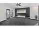 Spacious living room featuring a stylish accent wall and access to an outdoor patio at 3326 Butler Bay N Dr, Windermere, FL 34786