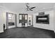 Main bedroom suite with plush carpeting, accent wall, custom built-ins, and a view into the bathroom at 3326 Butler Bay N Dr, Windermere, FL 34786