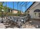 Outdoor kitchen with seating and a grill, providing a fantastic space for entertaining and enjoying outdoor meals at 3326 Butler Bay N Dr, Windermere, FL 34786