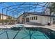 Screened-in pool featuring a spa, creating a private and relaxing outdoor oasis for leisure and recreation at 3326 Butler Bay N Dr, Windermere, FL 34786