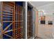 A fully built-in, temperature-controlled wine cellar offers ample storage and organization for wine enthusiasts at 3326 Butler Bay N Dr, Windermere, FL 34786