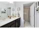 Bathroom featuring vanity sink, mirror, cabinets and bath with shower curtain at 34626 Salerno Cir, Sorrento, FL 32776