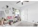 Bright bedroom featuring a ceiling fan, white walls, and carpeted flooring at 34626 Salerno Cir, Sorrento, FL 32776