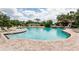 Large community pool surrounded by brick with a gazebo, lounge chairs, and lush landscape providing an enjoyable experience at 34626 Salerno Cir, Sorrento, FL 32776